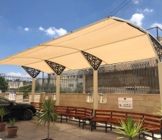 بنك الاسكان يتبرع بمظلة انتظار لجامعة القدس المفتوحة - فرع بيت لحم